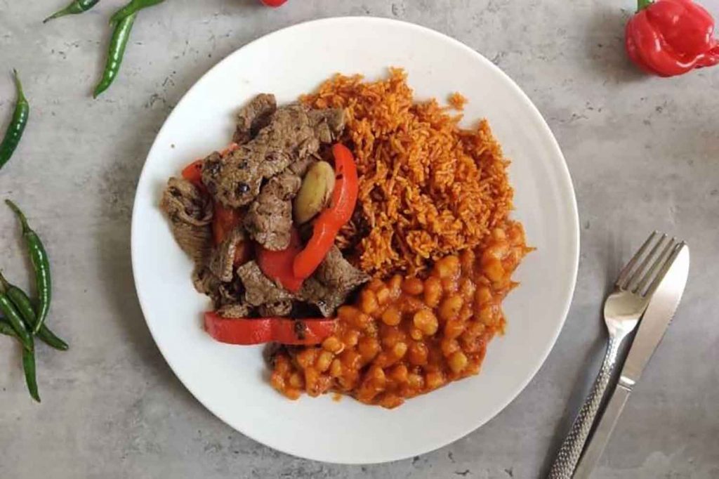Jollof Rice recipe in Recipes of Life: Stories of Migration and Brotherhood by Praxis and the GIANTS