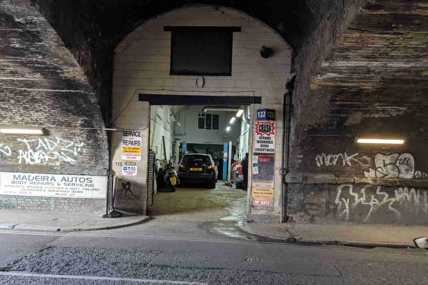 The entrance to Madeira garage, tucked under the railway bridge
