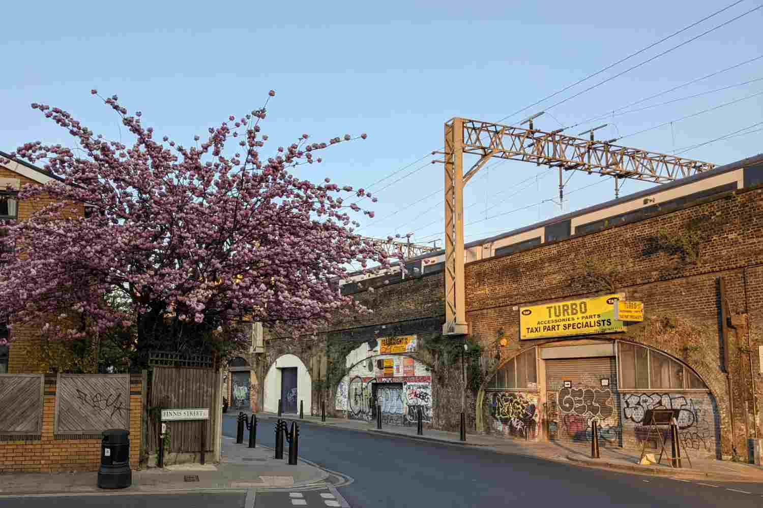 One of the railway arches with a blossom tree in front