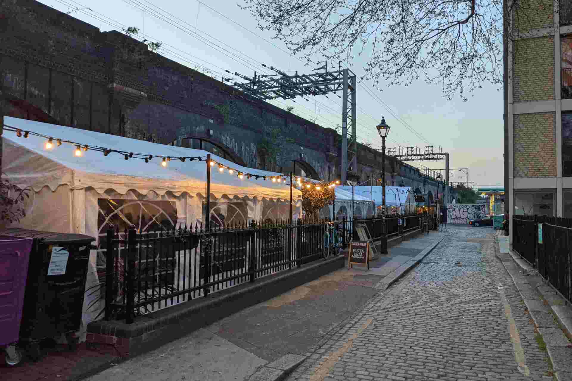 Row of restaurants in the converted railway arches at Paradise Row