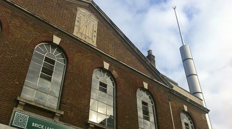 The Brick Lane Jamme Masjid with its sundial and minaret, Brick Lane, East London..