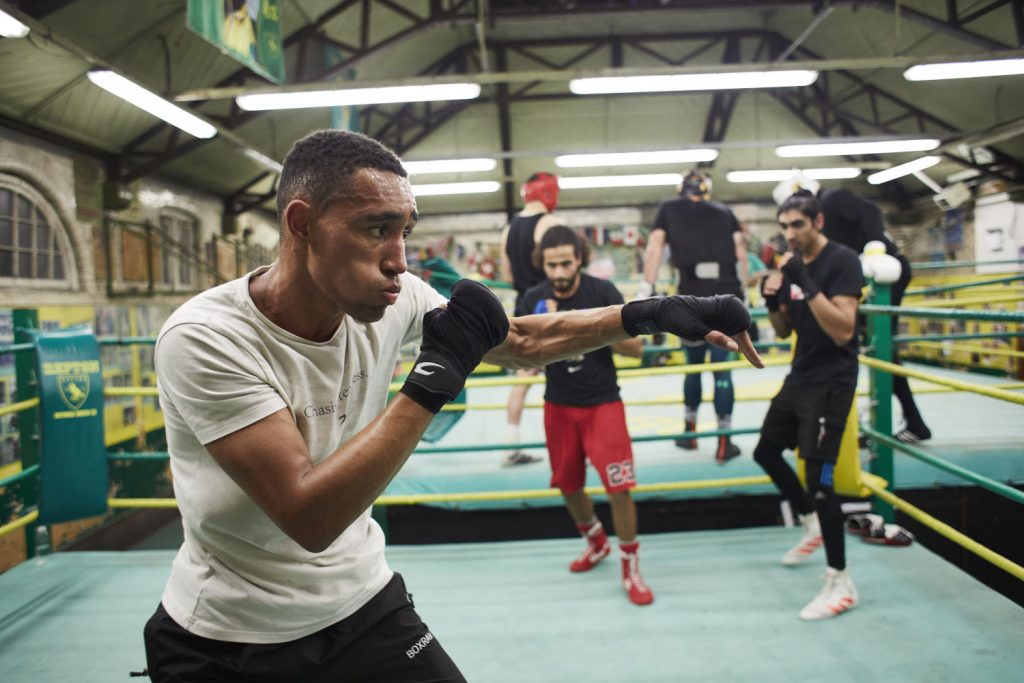 Repton Boxing Club participant looking focused whilst training, Victorian Bath House, Bethnal Green