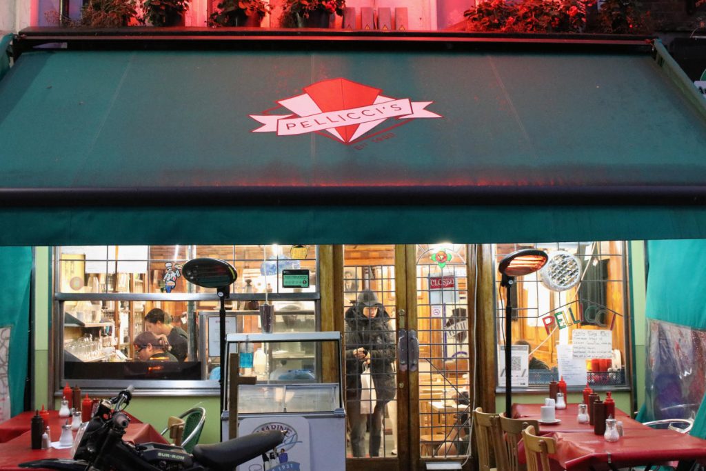 The front of E Pellicci cafe, with it's iconic green awning and red diamond, on Bethnal Green Road