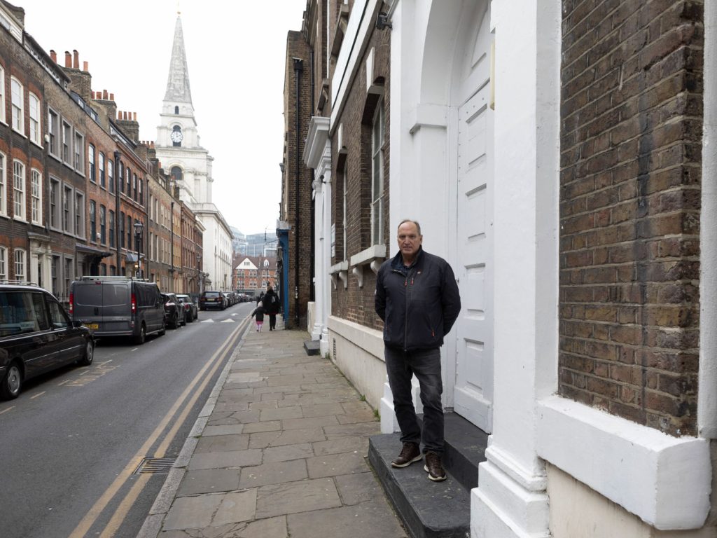 Paul Brumsom standing outside of the Brick Lane Jamme Masjid, near Brick Lane, Shoreditch.