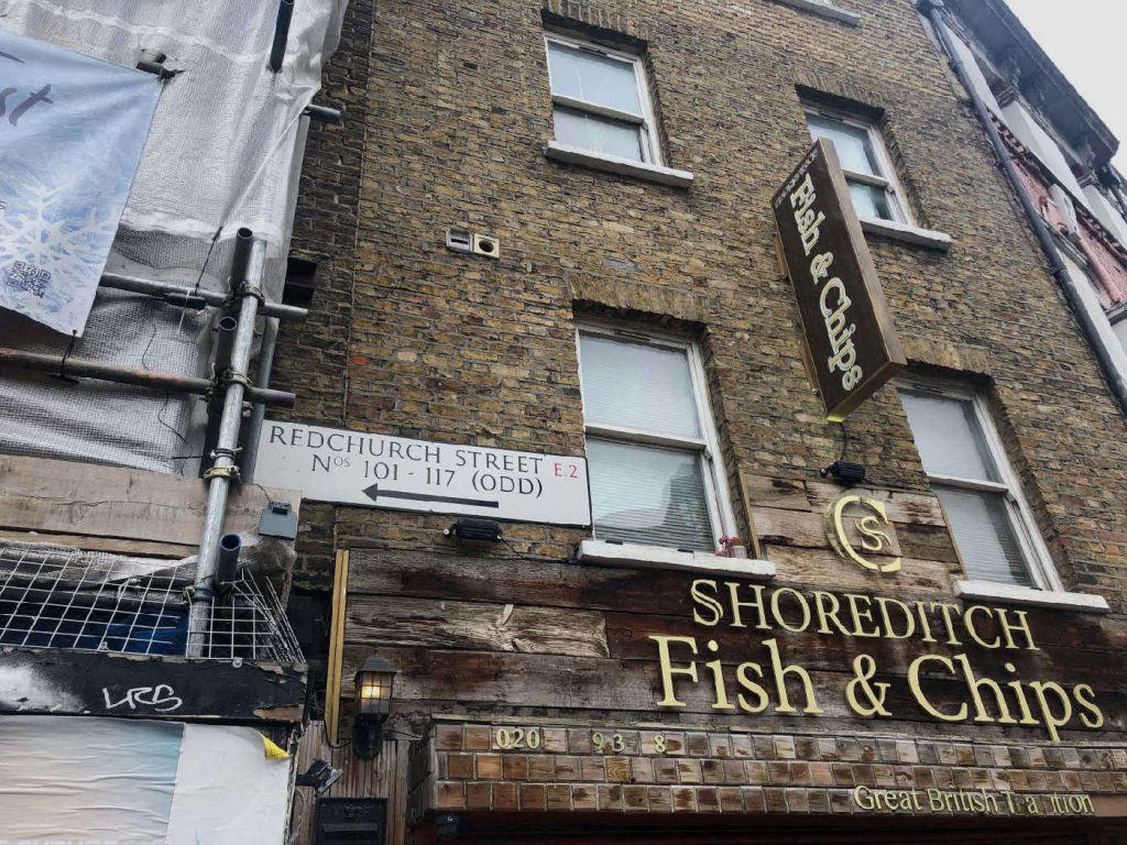 Redchurch Street Sign on the side of Shoreditch Fish and Chip shops which leads out onto the top of Brick Lane
