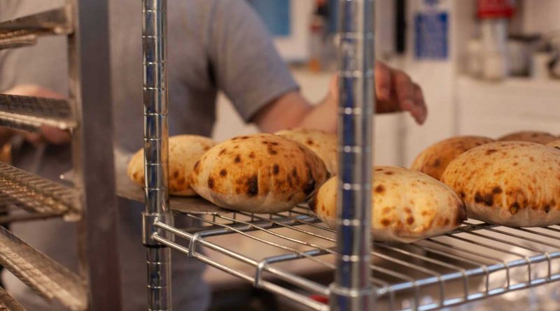 Flat breads being baked at the Limborough Hub, one of the Blueprint Architects, Tower Hamlets