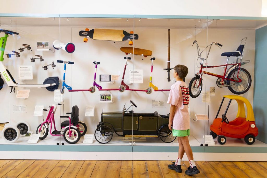 A child looking at bikes display at the Young V&A Museum