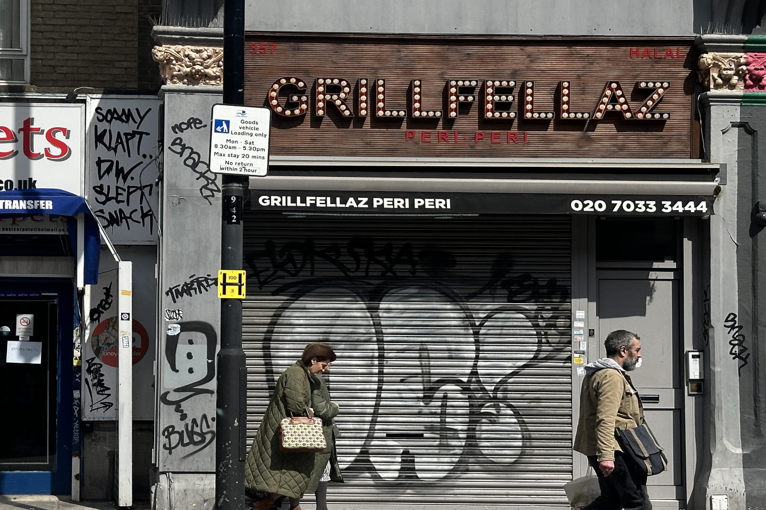 LED lights forming the word Grillfellaz on a brown coloured background on 357 Bethnal Green Road.