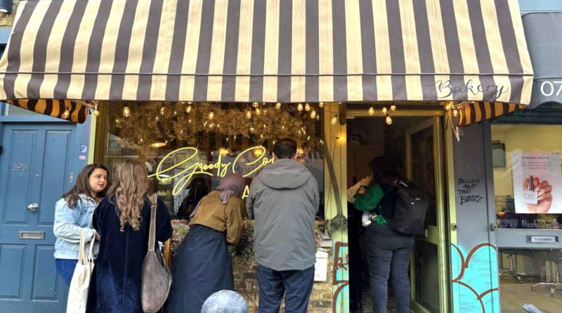 Customers queue outside Greedy Cow Bakery on Hackney Road at 11:30 AM.